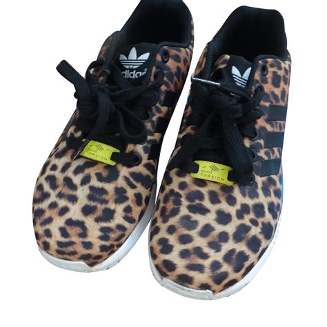 black Adidas with leopard print